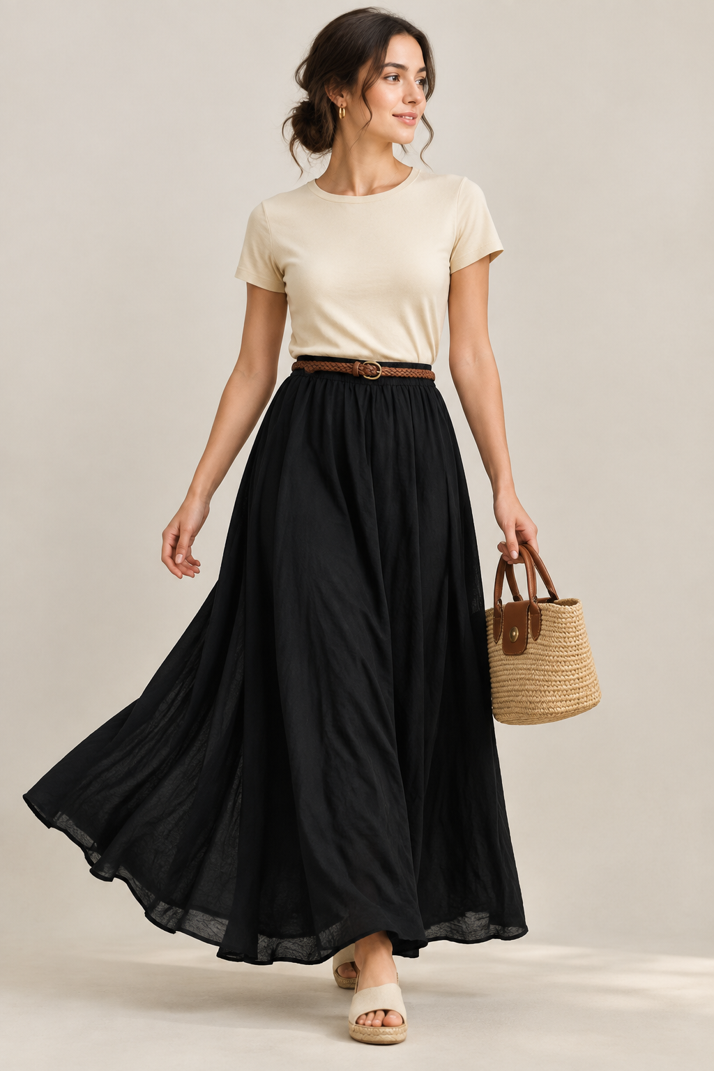Black free-flow high-waisted maxi skirt shown in motion on a model
